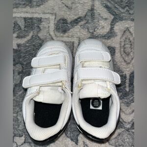 Nike with Velcro Straps.